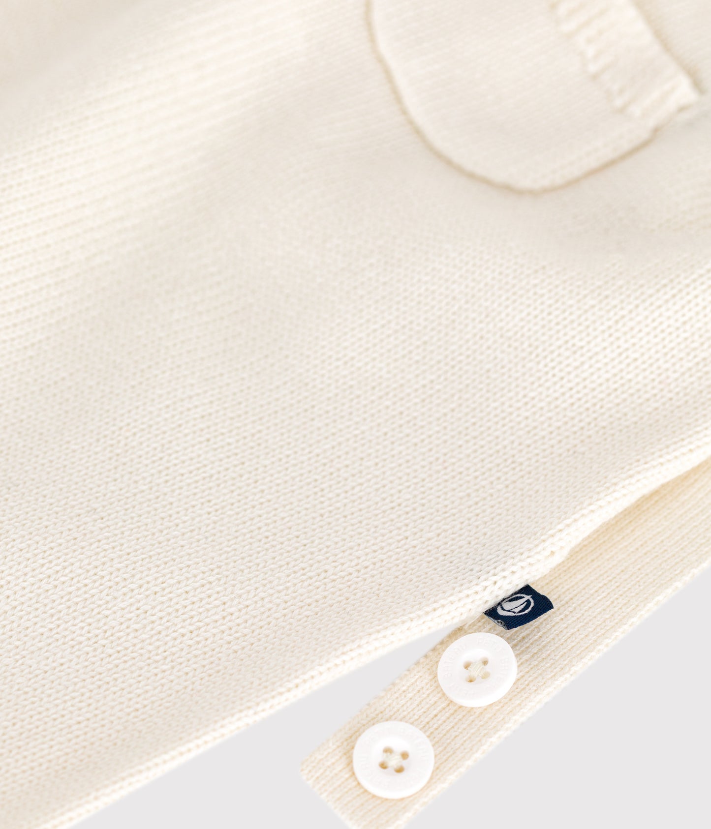 Overalls i hvid strikket uld og bomuld til baby