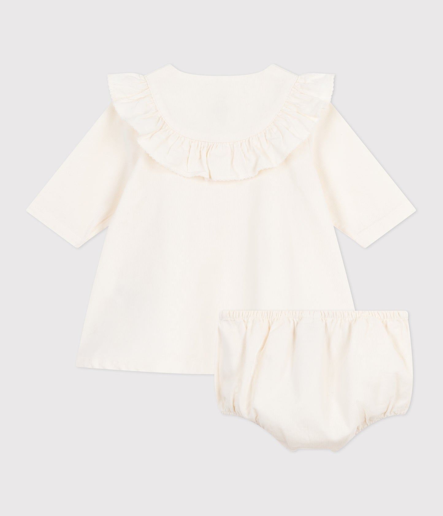 Råhvid fløjlskjole med broderet logo til baby