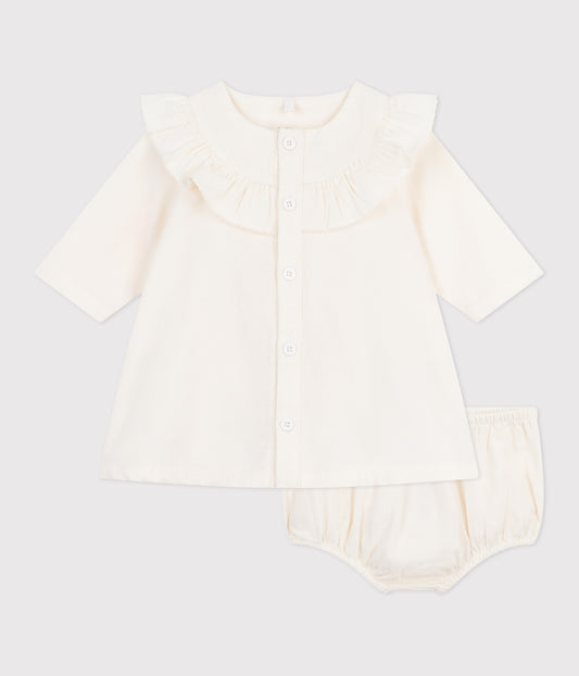 Råhvid fløjlskjole med broderet logo til baby