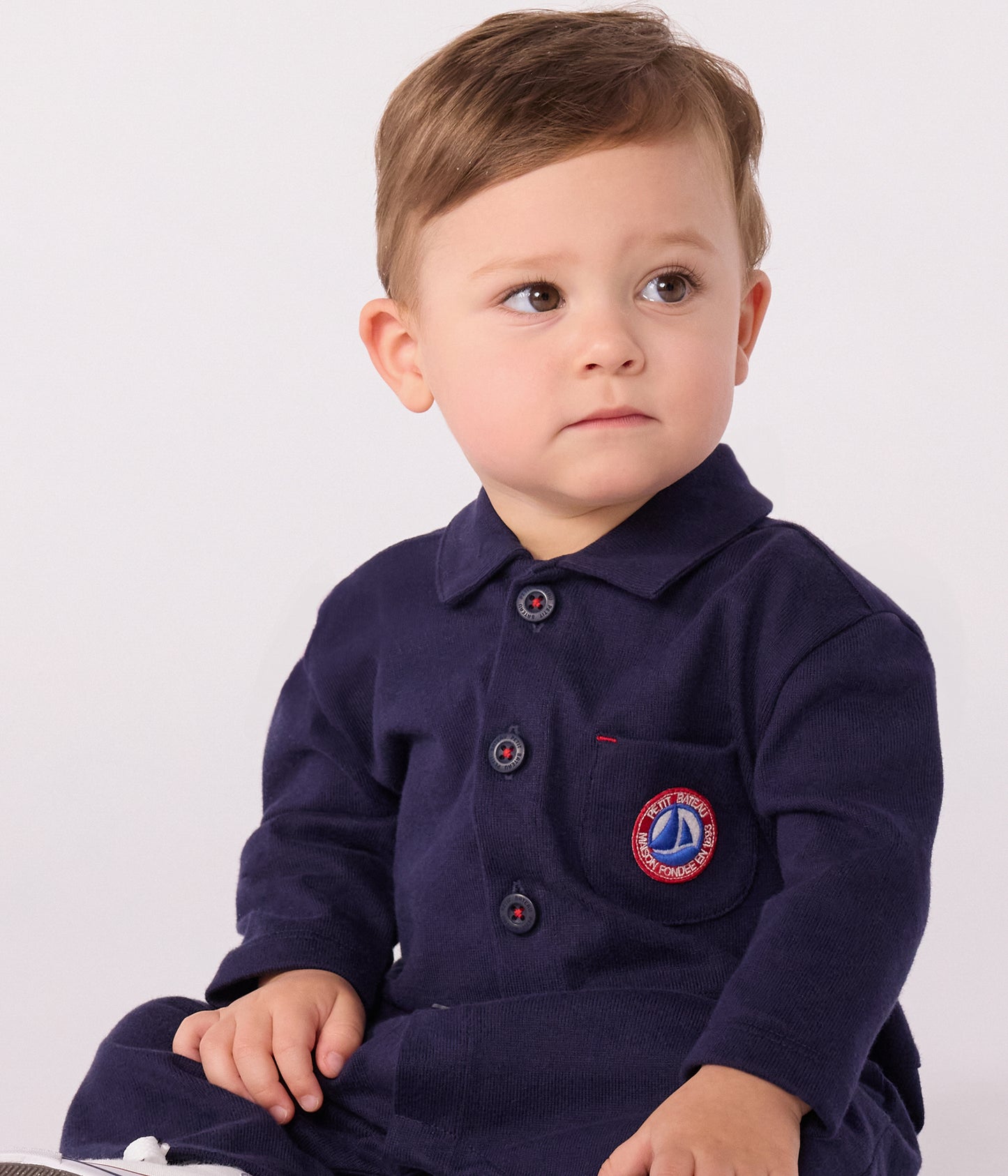 Overalls-inspireret buksedragt i mørkeblå til baby