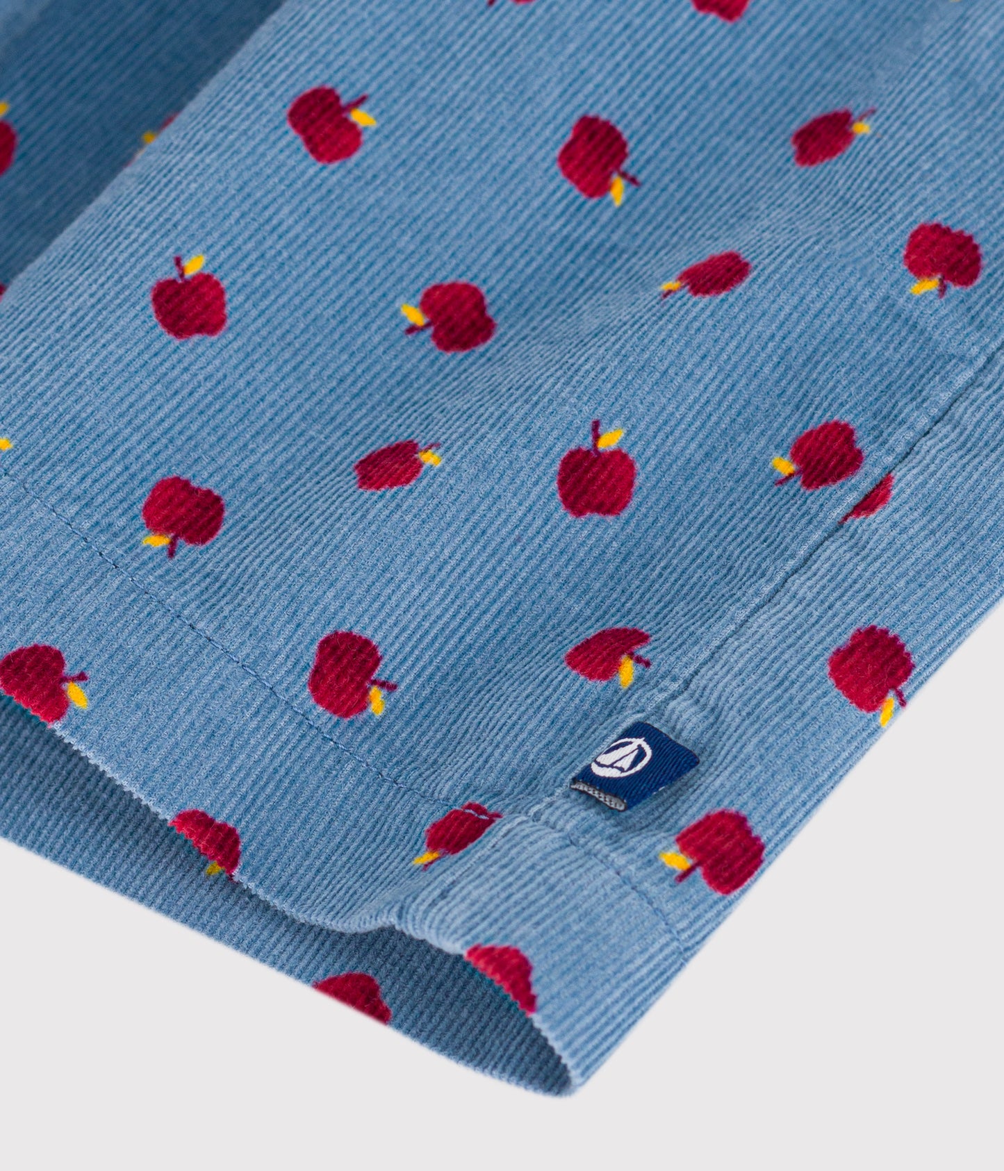 Blå fløjlskjole med æbleprint til baby