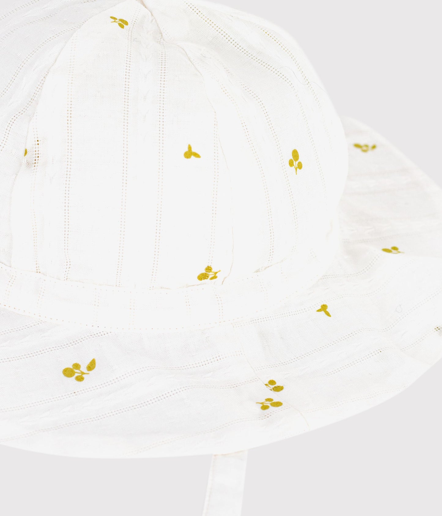 Solhat med bred skygge til baby med blomsterprint